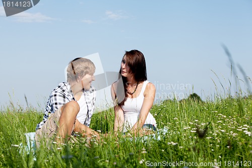 Image of young couple outdoor in summer on blanket in love