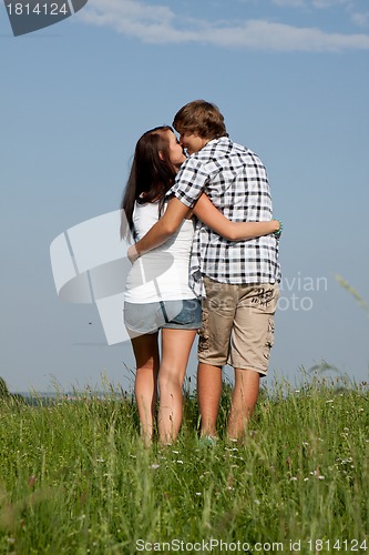 Image of young love couple smiling outdoor in summer 