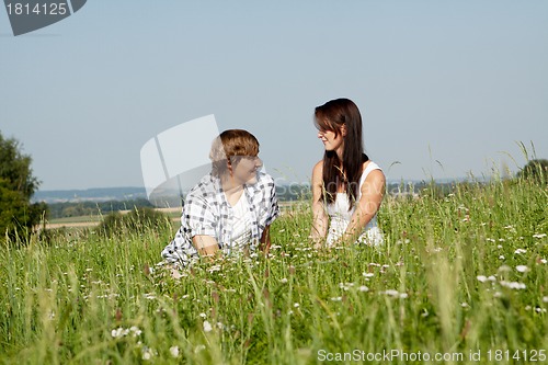 Image of young couple outdoor in summer on blanket in love
