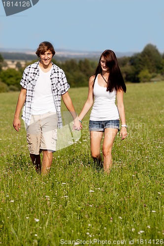 Image of young love couple smiling outdoor in summer 