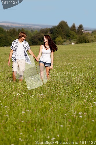 Image of young love couple smiling outdoor in summer 