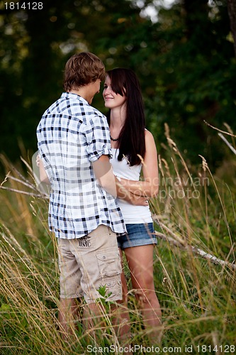 Image of young love couple smiling outdoor in summer 