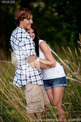 Image of young love couple smiling outdoor in summer 