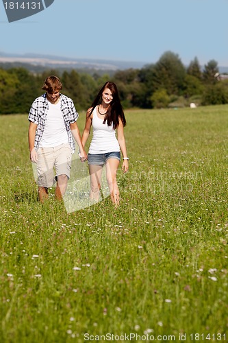 Image of young love couple smiling outdoor in summer 
