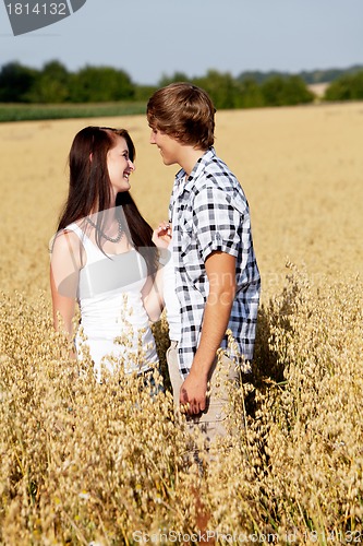 Image of happy couple in love outdoor in summer on field