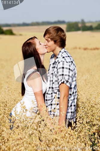 Image of happy couple in love outdoor in summer on field