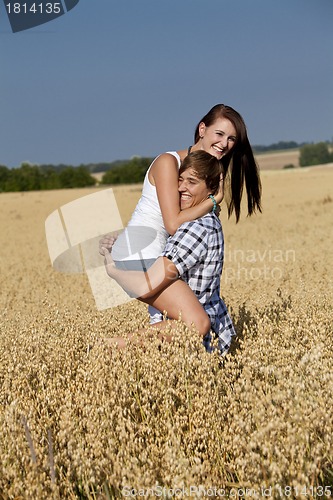 Image of happy couple in love outdoor in summer on field