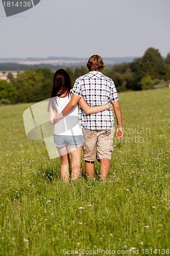 Image of young love couple smiling outdoor in summer 