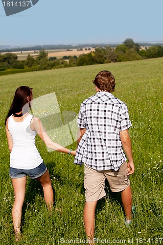 Image of young love couple smiling outdoor in summer 