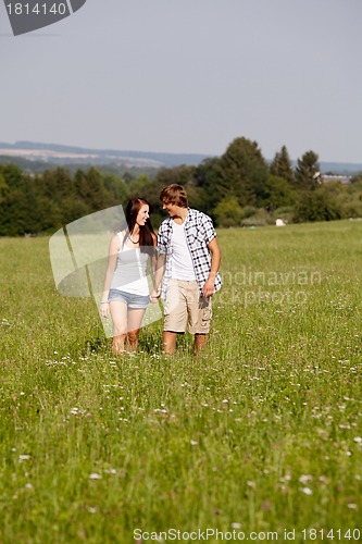 Image of young love couple smiling outdoor in summer 