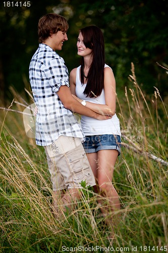 Image of young love couple smiling outdoor in summer 