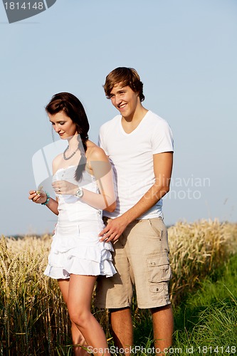 Image of happy couple in love outdoor in summer on field