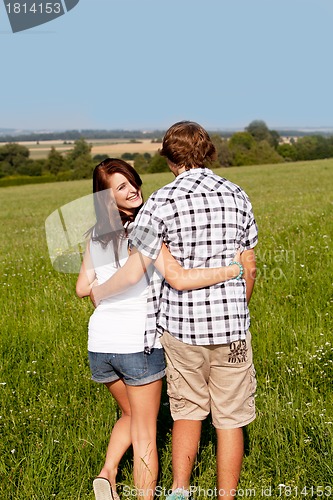 Image of young love couple smiling outdoor in summer 