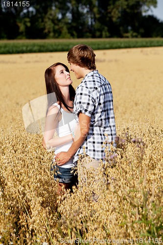 Image of happy couple in love outdoor in summer on field