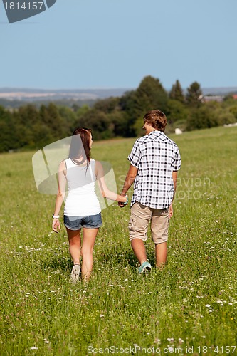 Image of young love couple smiling outdoor in summer 