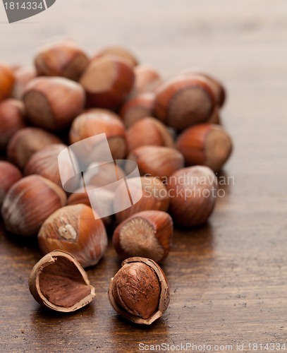 Image of Nuts at wooden table