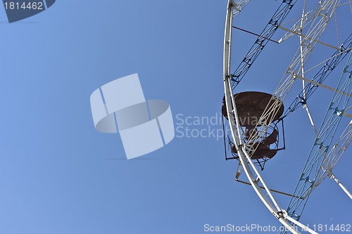 Image of ferris wheel against a blue sky