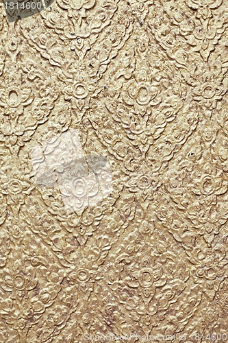 Image of brown background with golden patterns