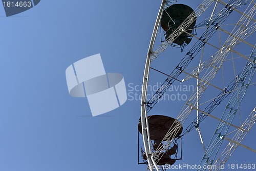 Image of ferris wheel against a blue sky