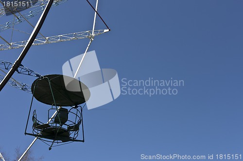 Image of ferris wheel against a blue sky