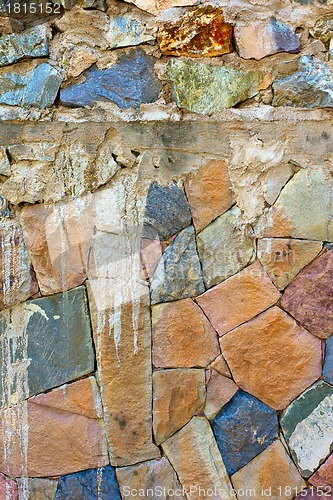 Image of colored Pattern of old stone Wall Surfaced