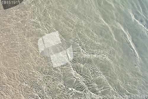 Image of Blue sea water with sunlight reflections