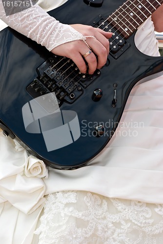Image of Close up of a female hand with  guitar