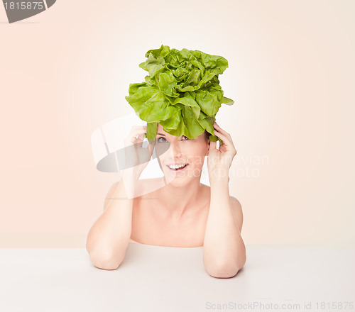 Image of Fun portrait of a woman wearing a lettuce