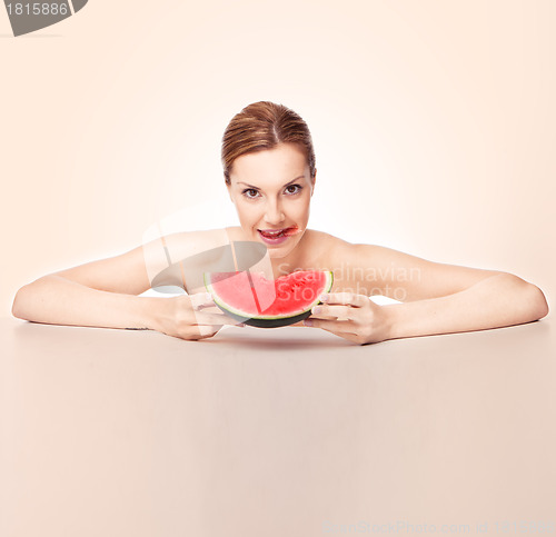 Image of Attractive woman with watermelon piece