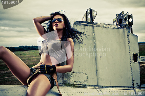 Image of Artistic portrait of woman sitting on plane