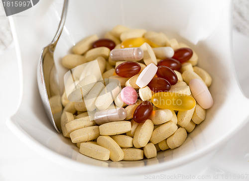 Image of Vitamins in bowl of tablets
