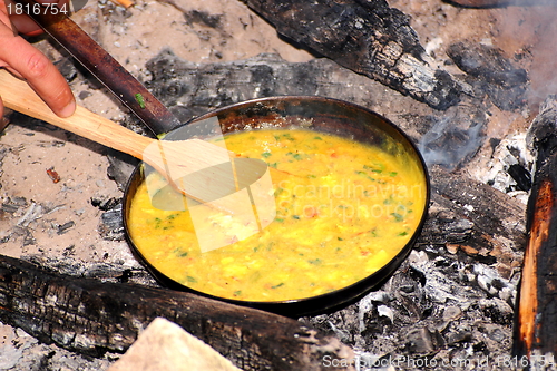 Image of cooking omelette on camp fire