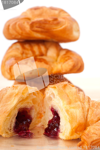 Image of croissant French brioche filled with berries jam