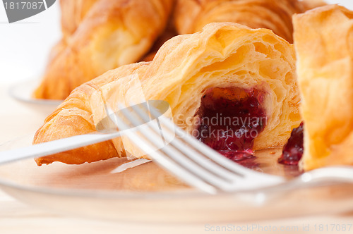 Image of croissant French brioche filled with berries jam