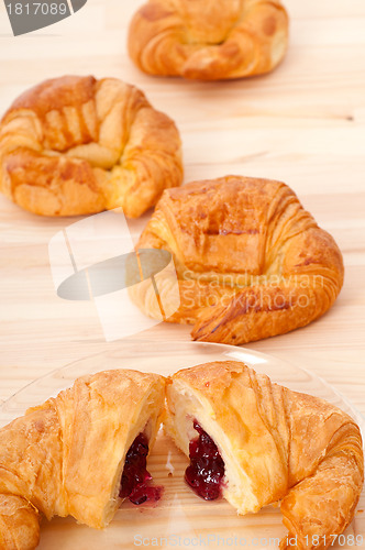 Image of croissant French brioche filled with berries jam