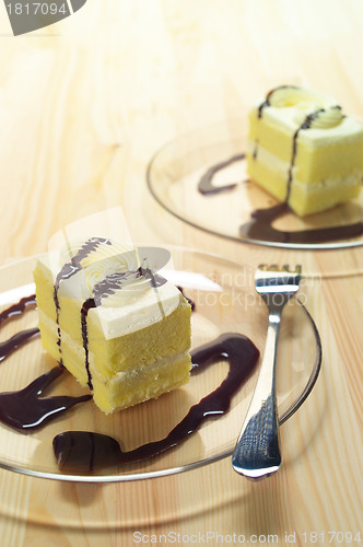 Image of fresh cream cake closeup with chocolate sauce