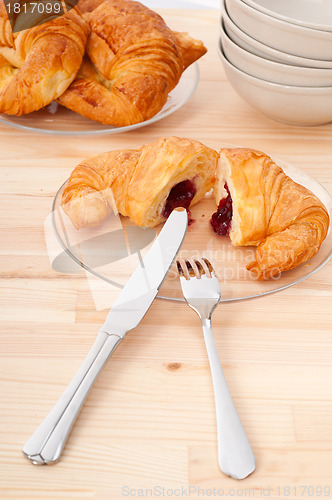 Image of croissant French brioche filled with berries jam