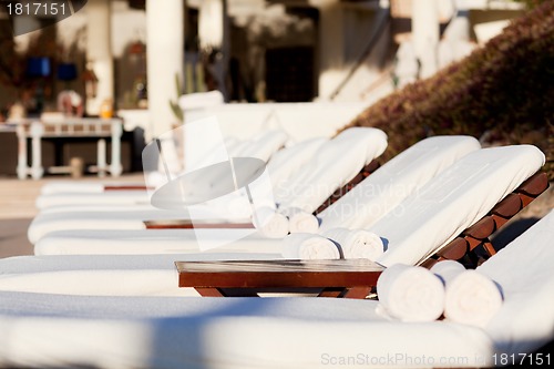 Image of sunbeds by the pool