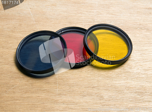 Image of camera lens filter set blue red yellow