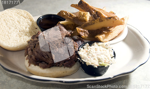 Image of brisket beef sandwich steak fries barbecue sauce 