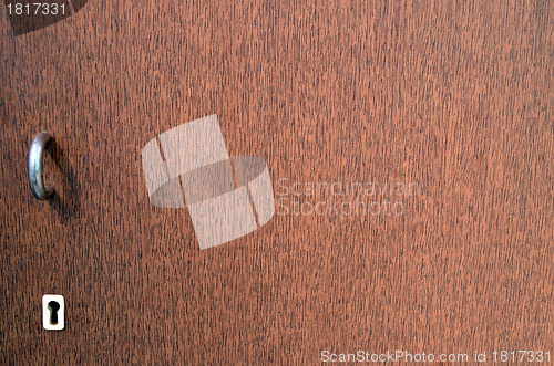 Image of Retro brown cupboard key hole handle background 