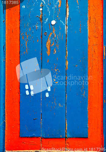 Image of Blue and red wooden board lumber.