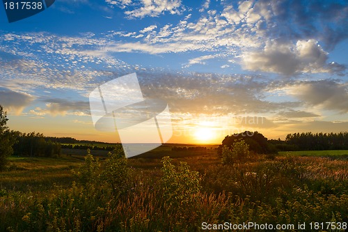 Image of Sunset over green fields