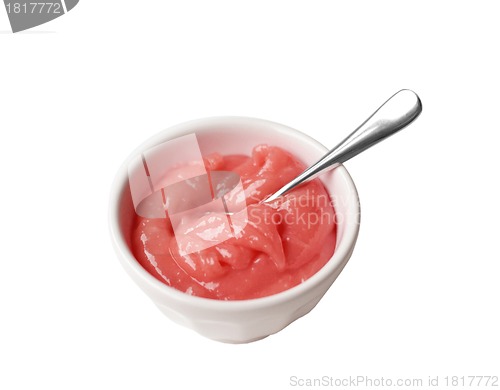 Image of Cup of apricot marmalade on white background