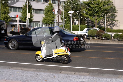 Image of Scooter in the traffic