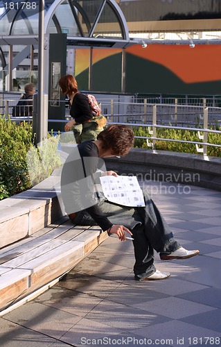 Image of Man reading a magazine