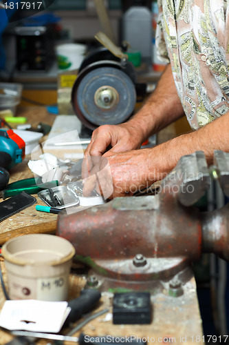 Image of Senior working in workshop