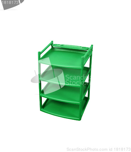Image of Green plastic shelves isolated on white