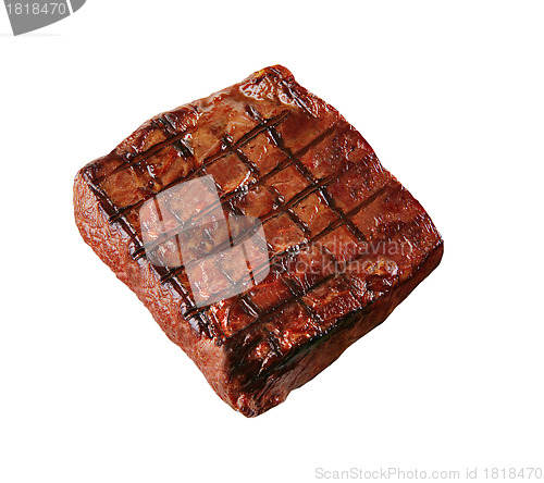 Image of hot fresh grilled boneless rib eye steak isolated on white with barbecue grill marks in the meat