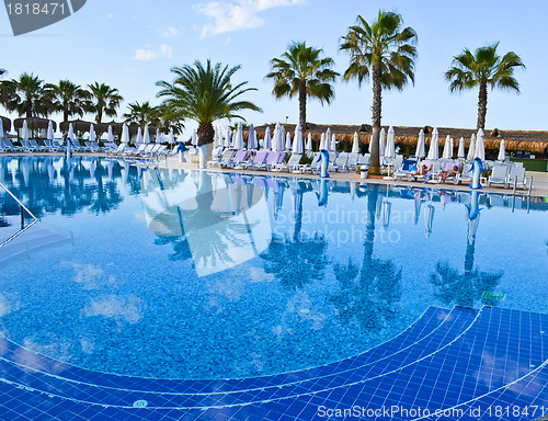 Image of Water pool and chairs - vacation background